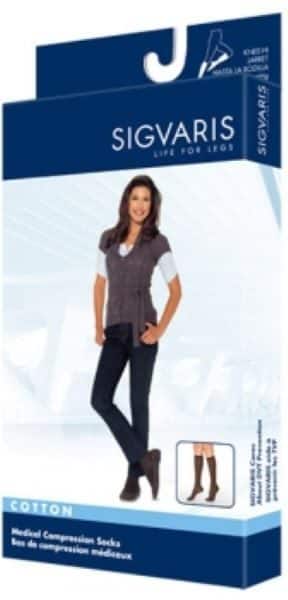 Packaging for Sigvaris medical compression socks. Features an image of a woman standing, wearing dark pants and top, with a smaller image of the knee-high socks on the side. Blue and white design with product details in text.