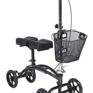 A black knee scooter with four wheels, handlebars, a padded knee rest, and a wire mesh basket attached to the front. The scooter is designed for mobility support and resting an injured leg.