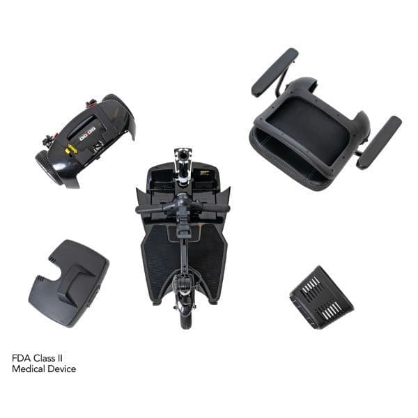 Overhead view of disassembled medical mobility scooter parts on a white background, including a seat, base, battery pack, and additional components labeled FDA Class II Medical Device.