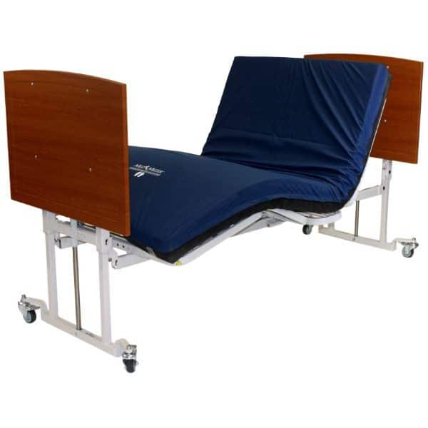Adjustable hospital bed with a blue mattress and wooden headboard and footboard. The bed frame is metal with wheels for easy mobility.