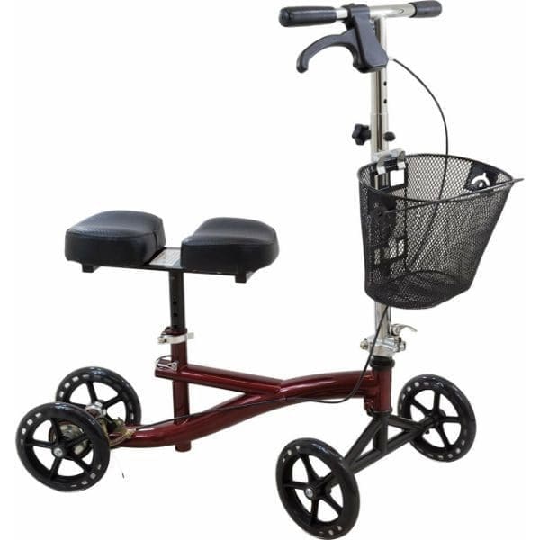 A knee walker scooter with four wheels, a padded knee rest, and a handlebar with a brake. It features a wire basket attached to the front for carrying items. The frame is a maroon color.