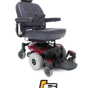 A red and black power wheelchair with padded armrests and footrests. It features a joystick on the right armrest for control. Below the wheelchair is the logo J6.