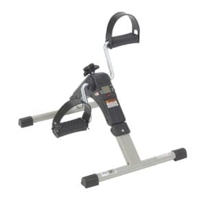 A portable pedal exerciser with adjustable resistance and a digital display. It features foot straps for secure use and is designed for low-impact exercise, suitable for legs or arms. The structure is compact and foldable, ideal for home workouts.