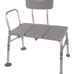 A gray shower transfer bench with an adjustable backrest and handrail. The bench has textured surfaces for grip and suction cup feet for stability. Designed to assist with safe transfers in and out of the bathtub.