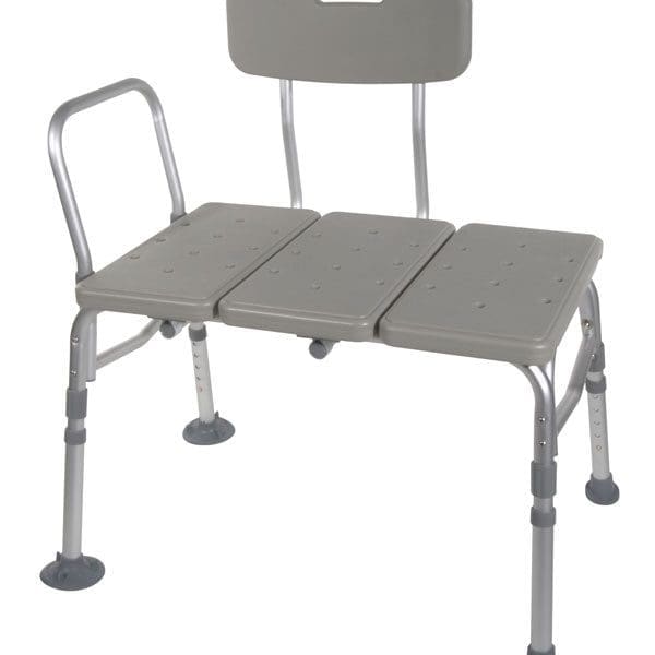 A gray shower transfer bench with an adjustable backrest and handrail. The bench has textured surfaces for grip and suction cup feet for stability. Designed to assist with safe transfers in and out of the bathtub.