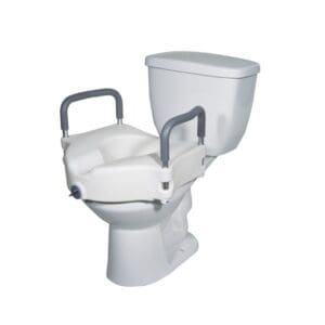 A white toilet with a raised toilet seat and gray handles attached, designed for accessibility and support.