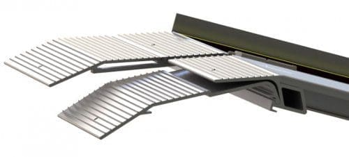 A modern industrial vent with adjustable slats and a sleek, metallic finish. The design features overlapping panels and grooves, suggesting functionality in airflow management or environmental control.