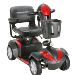 A red and black mobility scooter with a cushioned seat, armrests, and a basket at the front. It has four wheels and a handlebar for steering.