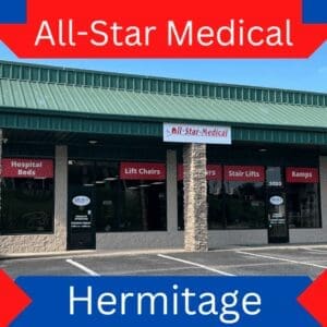 Image of a storefront for All-Star Medical in Hermitage. The building has a green roof and display windows showing products like hospital beds, lift chairs, scooters, stair lifts, and ramps. Red and blue signage highlights the stores offerings.