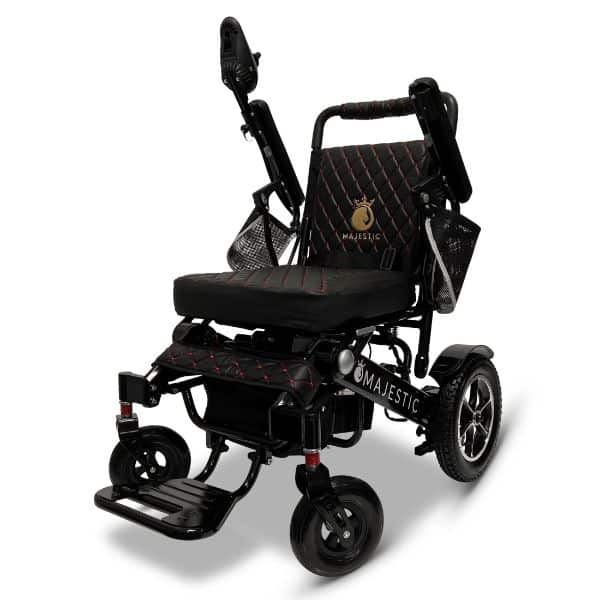 The sleek black MAJESTIC IQ-7000 Auto Folding Remote Controlled Electric Wheelchair features a cushioned seat and backrest, joystick control on the armrest, and large rear wheels for stability. Its frame is adorned with a refined gold Majestic logo on the backrest.