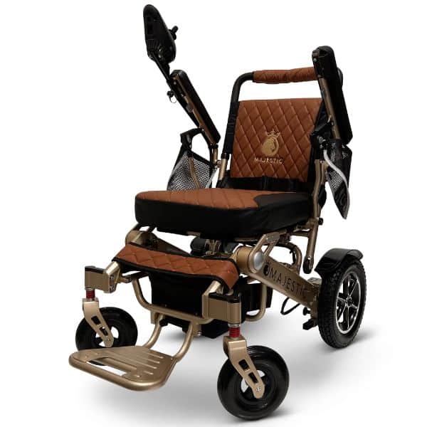 The MAJESTIC IQ-7000 Auto Folding Electric Wheelchair offers a quilted seat, backrest with armrests, and sleek design featuring small front wheels and larger rear wheels. Majestic is emblazoned on the frame, combining style with advanced functionality.