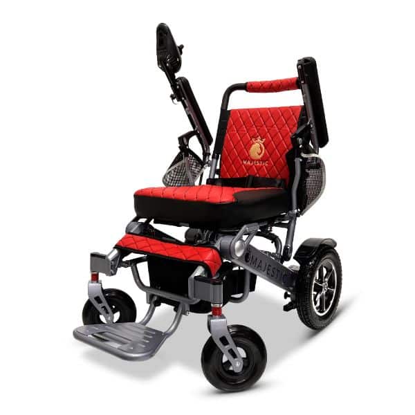 The lightweight MAJESTIC IQ-7000 Auto Folding Remote Controlled Electric Wheelchair features a red and black quilted design, adjustable armrests, a foldable structure, and sturdy wheels for improved mobility and comfort.
