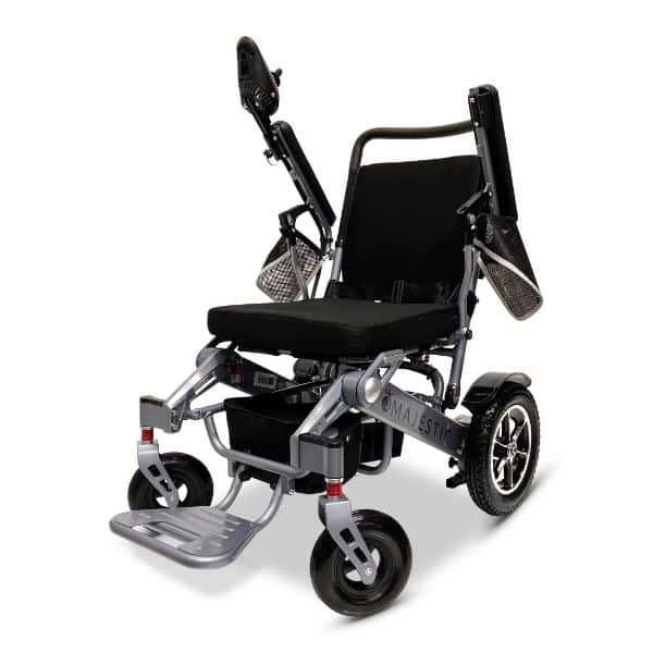 The MAJESTIC IQ-7000 Auto Folding Remote Controlled Electric Wheelchair features a sleek black and silver design, adjustable armrests, a padded seat, large rear wheels, smaller front wheels for smooth maneuvering, and a foldable footrest for enhanced portability.