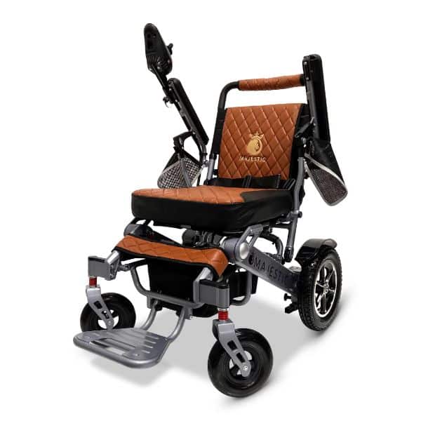 Introducing the stylish MAJESTIC IQ-7000 Auto Folding Remote Controlled Electric Wheelchair, featuring a quilted brown and black design, comfortable seat with storage netting armrests, sturdy metal frame, large rear wheels, and smaller front wheels for easy maneuverability.