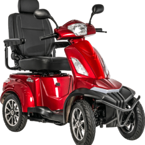 The PRIDE MOBILITY BAJA RAPTOR 2 4 WHEEL SCOOTER is red with a black seat and handlebars, featuring a robust design with large wheels, headlights, and armrests for user accessibility and comfort.