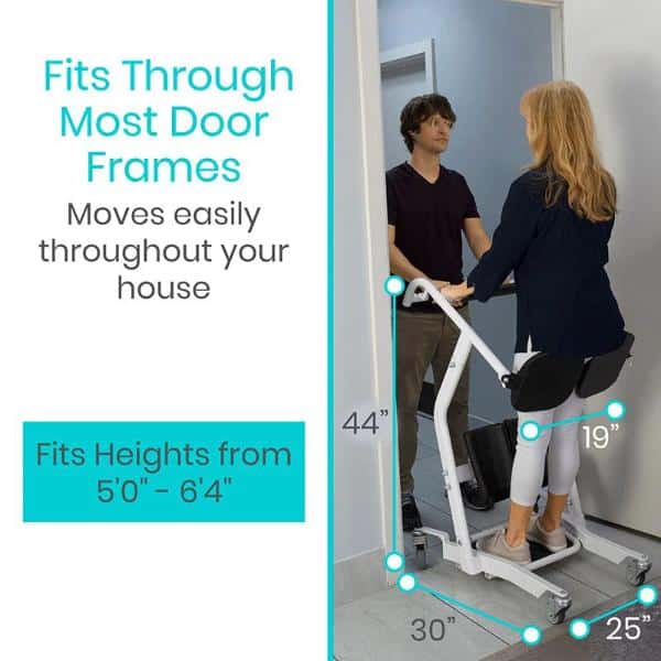 A woman uses the Transport Stand Assist, conversing with a man in a doorway. The device, accommodating individuals from 50 to 64, is compact enough to fit through most door frames, and its sleek design features clearly marked measurements.