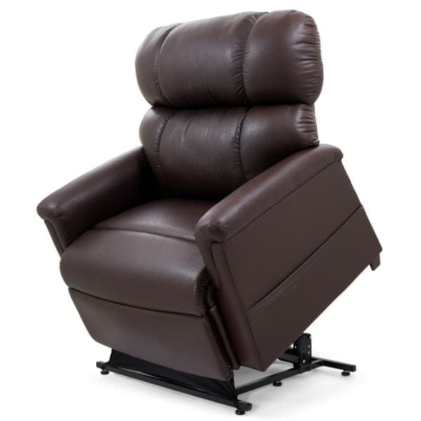 The PR 535 Extra Wide Comforter with MaxiComfort in Large/Wide reclines effortlessly, featuring dark brown leather, padded armrests, and a high backrest. Its robust black metal base supports up to 600 lbs when partially raised.