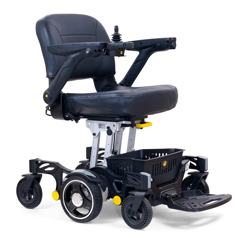 The Buzzaround Carry On Powerchair is a stylish black motorized wheelchair with a cushioned seat, backrest, armrests, and a right-hand joystick. It has four wheels, a footrest, basket, and eye-catching yellow accents.