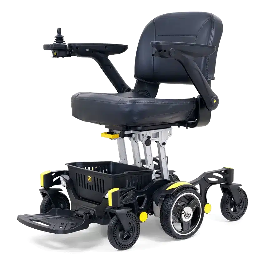 Introducing the Buzzaround Carry On Powerchair: this foldable electric wheelchair boasts a sleek black cushioned seat, joystick control on the armrest, and a footrest. It features a stylish silver frame with yellow accents, four wheels, and a practical storage basket beneath.